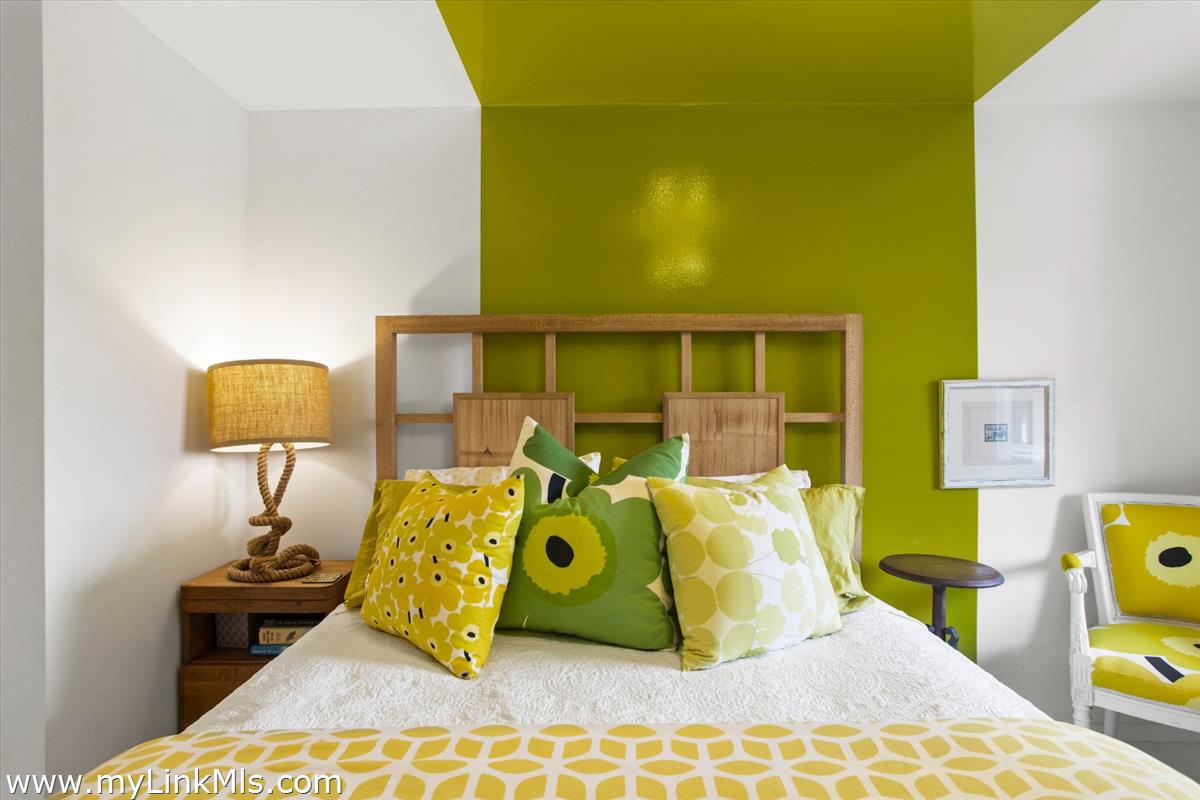 13 Parson Lane Nantucket, MA 02554 - Photo 40 of 44 a bed room with a bed and a lamp