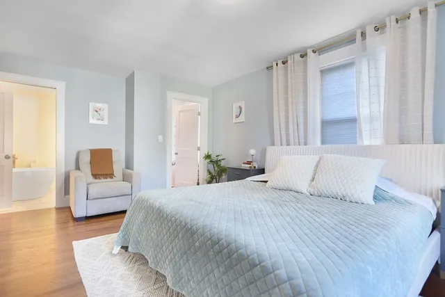 a bedroom with a large bed and furniture