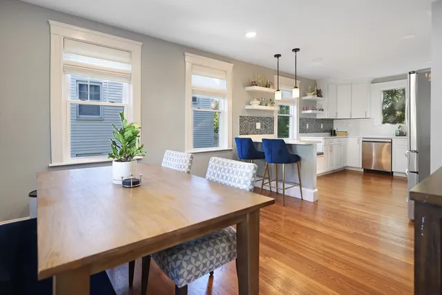 a view of kitchen with cabinets and wooden floor