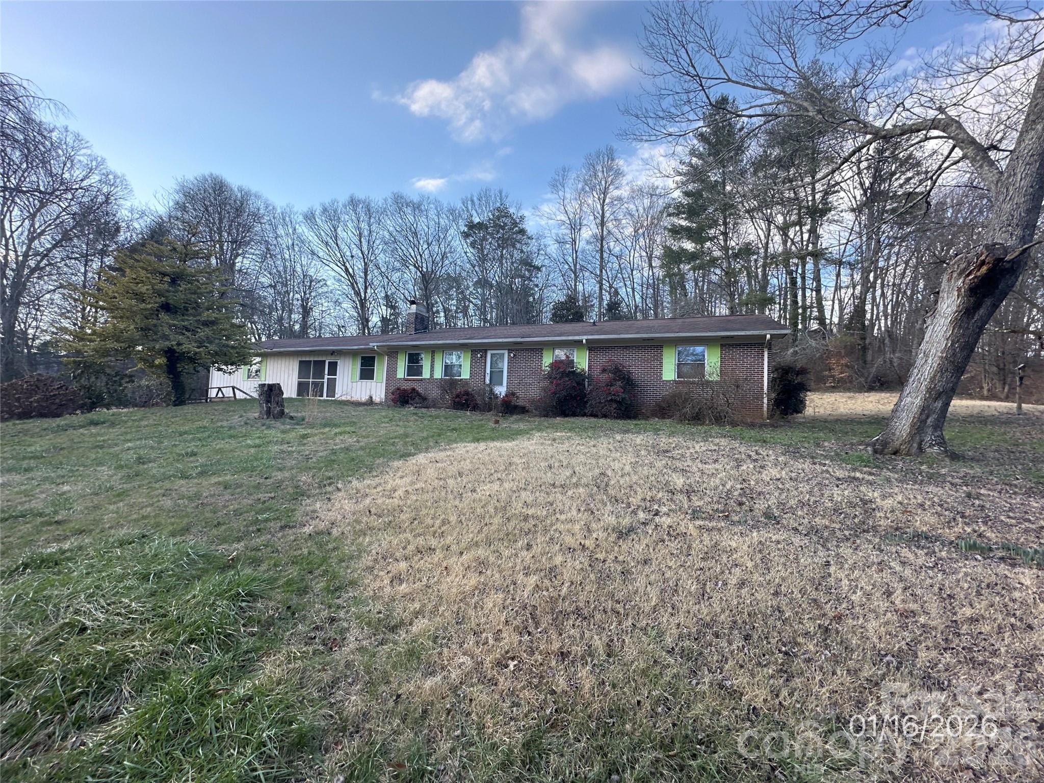 129 Ridgecrest Avenue Marble, NC 28905 - Photo 2 of 24 a view of a house with a yard