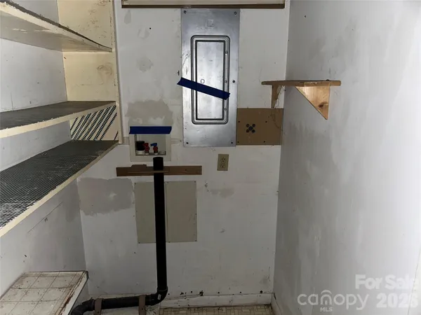 a view of staircase with white walls