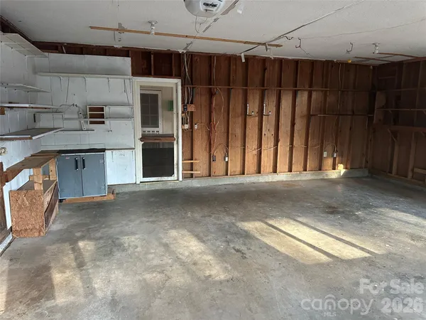 a view of a room with wooden walls