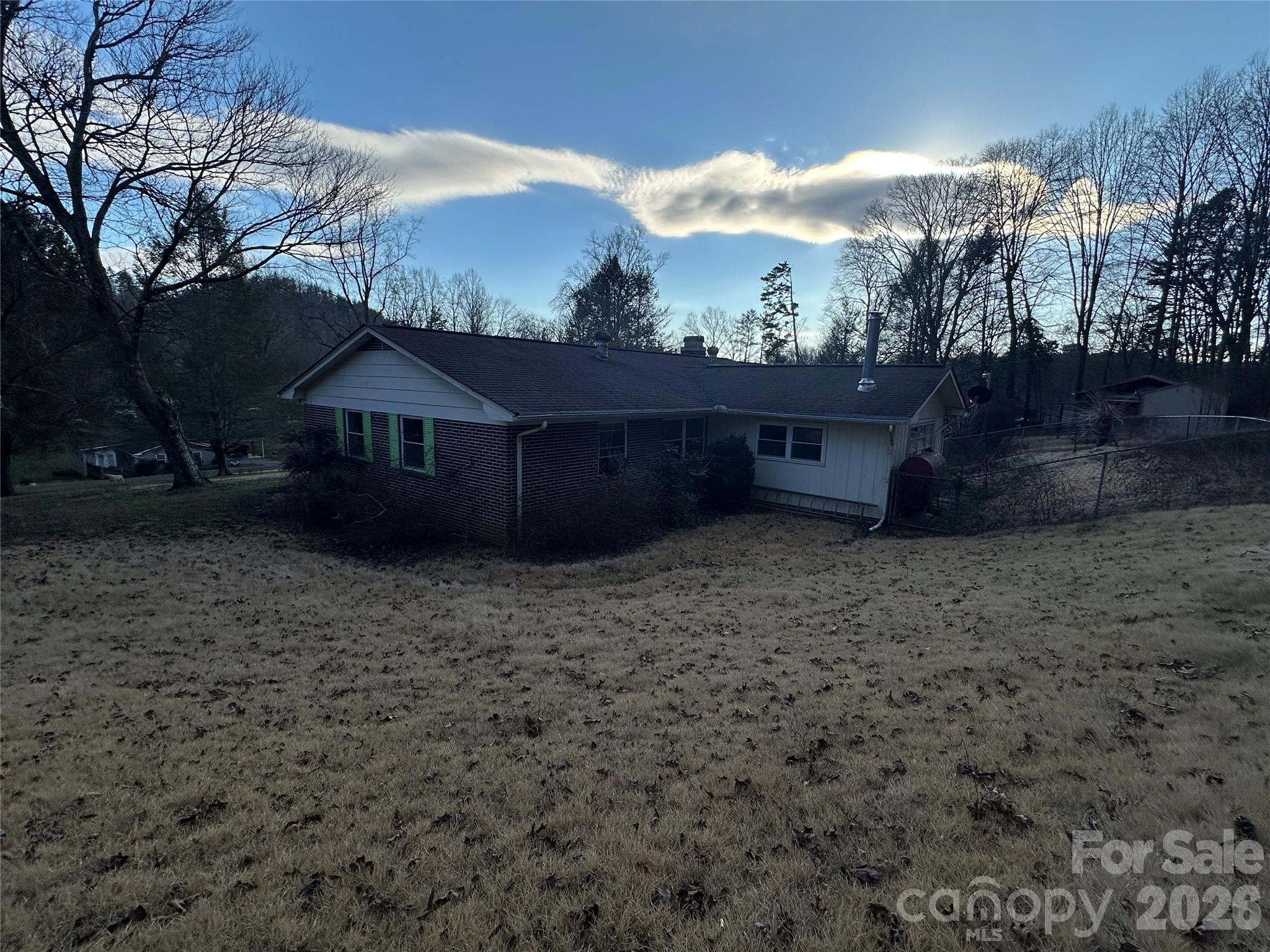 129 Ridgecrest Avenue Marble, NC 28905 - Photo 4 of 24 a view of a house with a yard