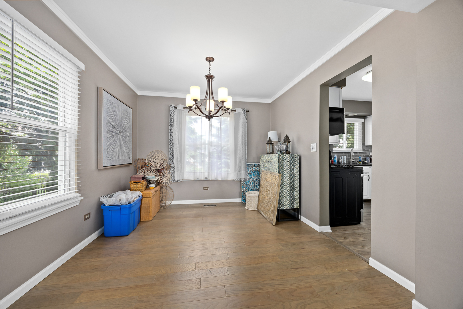2 Buckboard Court Bolingbrook, IL 60490 - Photo 12 of 33 a living room with furniture and a chandelier