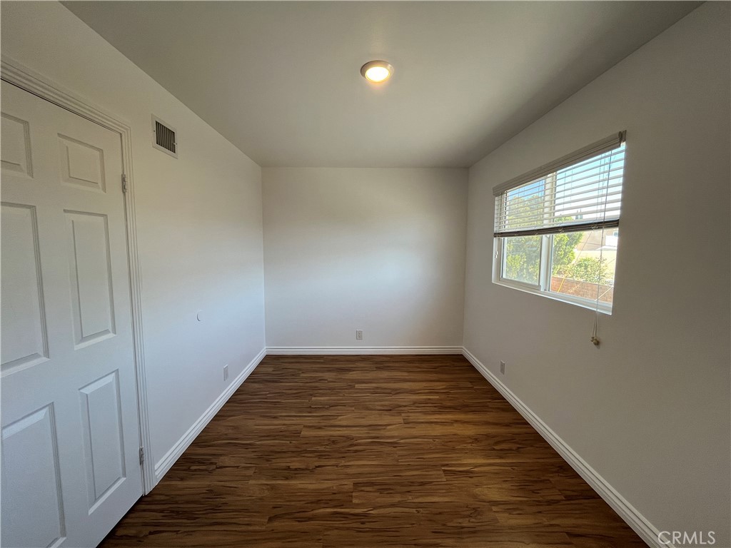 2476 Pierce Court Simi Valley, CA 93065 - Photo 12 of 18 wooden floor in an empty room with a window
