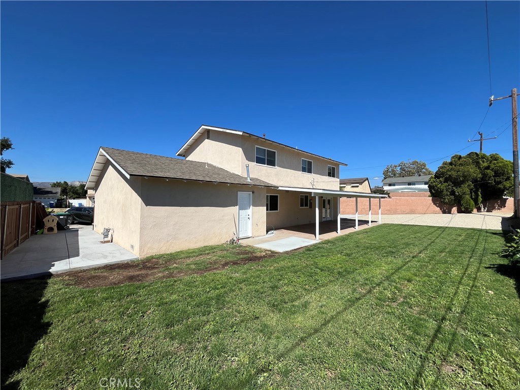 2476 Pierce Court Simi Valley, CA 93065 - Photo 17 of 18 a front view of a house with a yard and garage