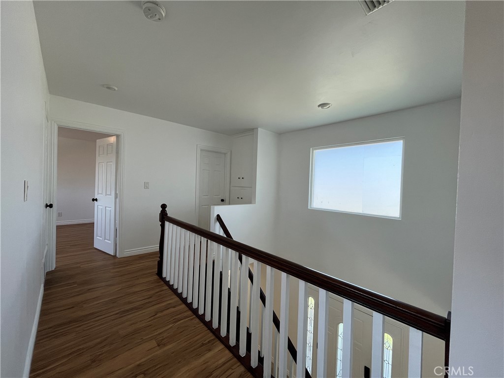 2476 Pierce Court Simi Valley, CA 93065 - Photo 8 of 18 a view of a hallway with wooden floor