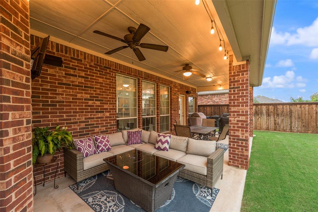 11920 Vienna Apple Road Fort Worth, TX 76244 - Photo 38 of 40 Expansive backyard patio equipped with lights, speakers, ceiling fans, gas stub and 220V outlet at 11920 Vienna Apple in Villages of Woodland Springs community in North Fort Worth