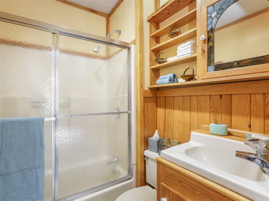 2536 County Line Road Champion, PA 15622 - Photo 20 of 25 The full bath is mostly oak with a tub/shower combination and shower door too!