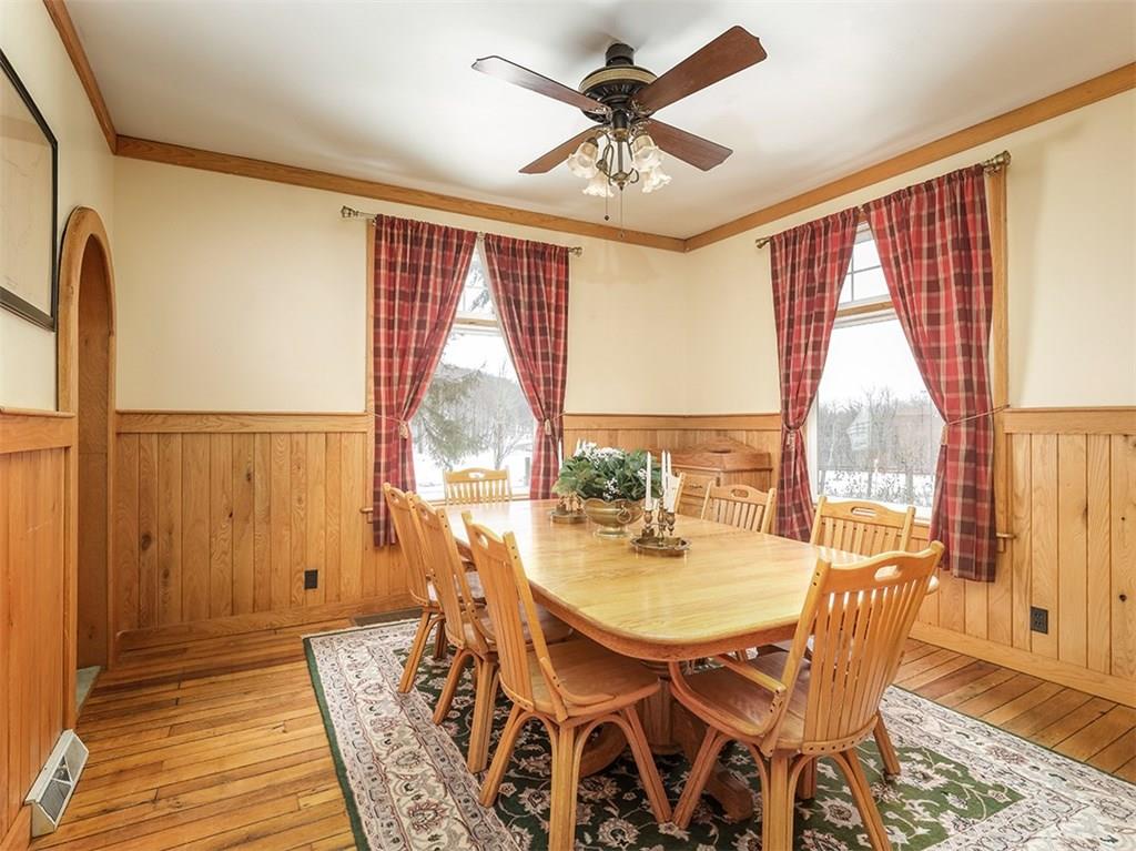 2536 County Line Road Champion, PA 15622 - Photo 4 of 25 Here's the large dining room with loads of light from the two windows! Note the paneling and the floors!