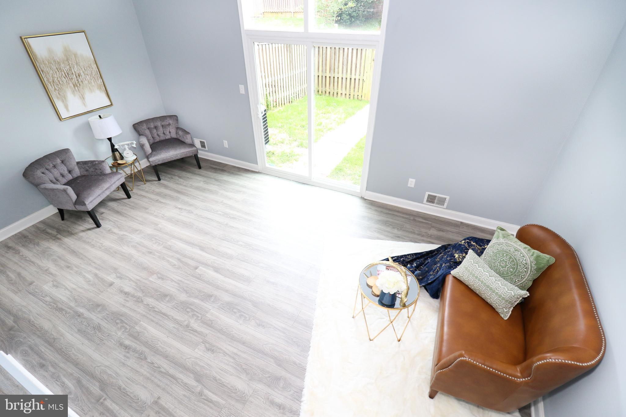 2309 Ravensdon Court Reston, VA 20191 - Photo 21 of 76 a living room with furniture and a window