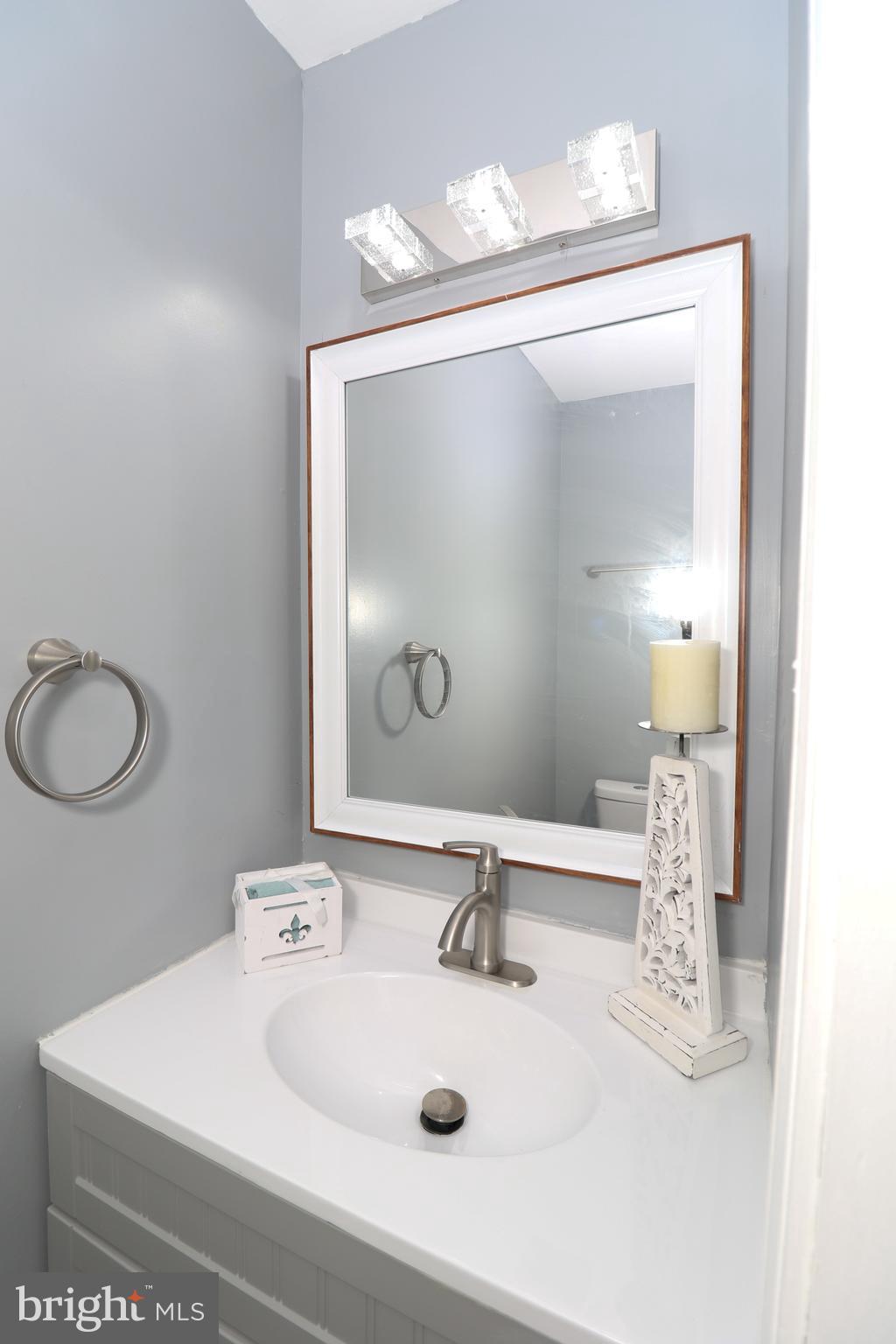 2309 Ravensdon Court Reston, VA 20191 - Photo 22 of 76 a bathroom with a sink and a mirror
