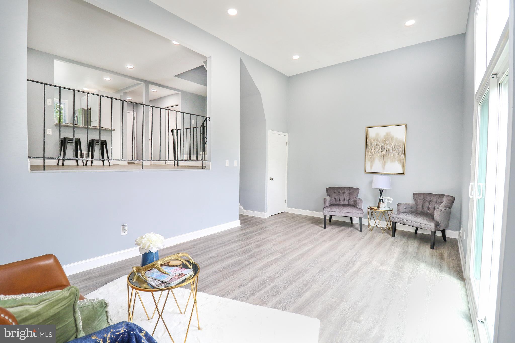 2309 Ravensdon Court Reston, VA 20191 - Photo 26 of 76 a living room with furniture and a window