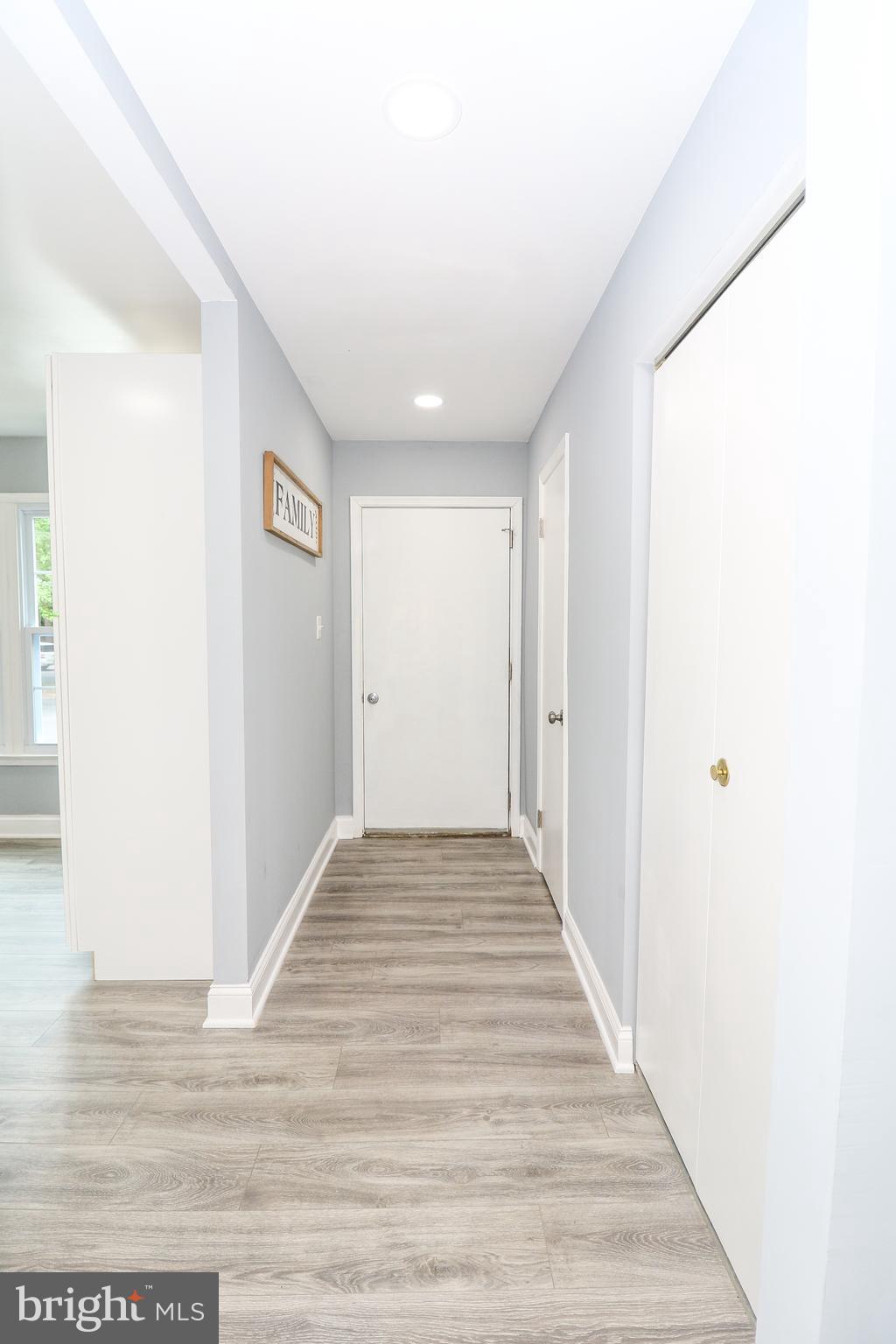 2309 Ravensdon Court Reston, VA 20191 - Photo 4 of 76 a view of a hallway with wooden floor