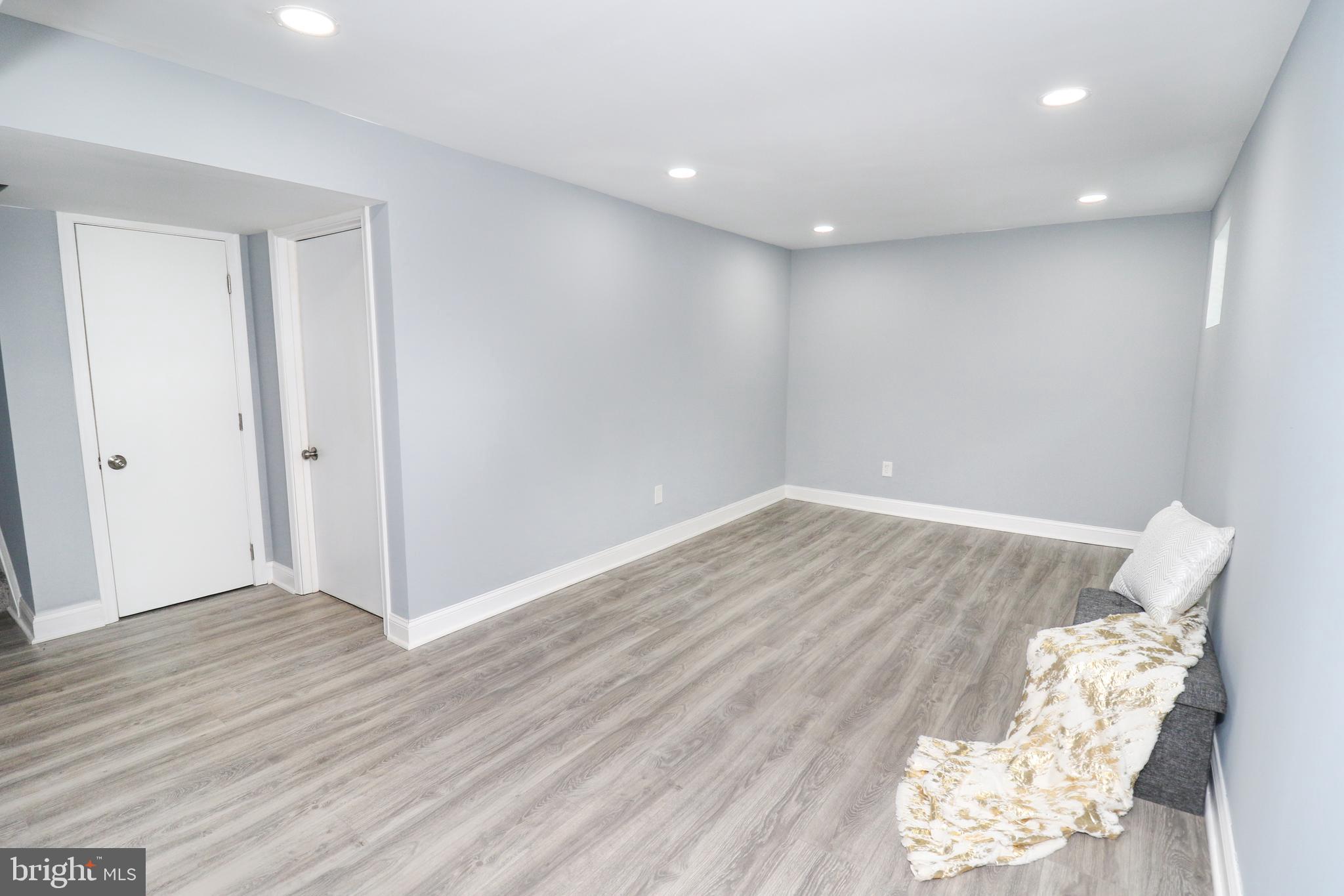 2309 Ravensdon Court Reston, VA 20191 - Photo 32 of 76 an empty room with wooden floor and a window