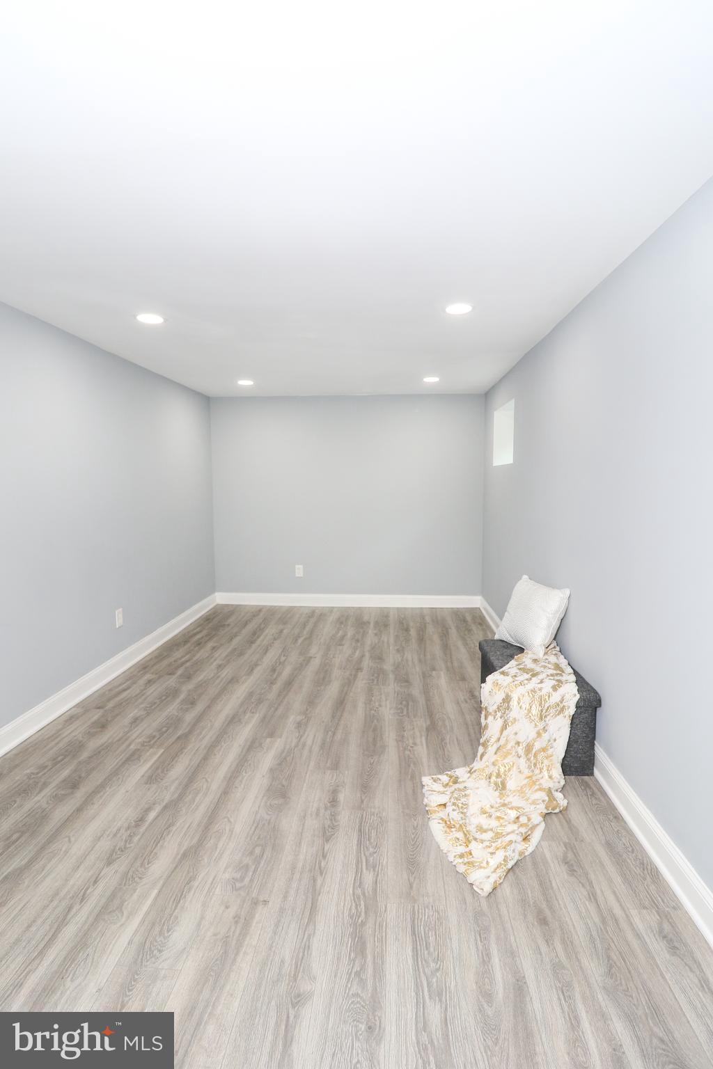 2309 Ravensdon Court Reston, VA 20191 - Photo 35 of 76 a view of wooden floor and chair in a room