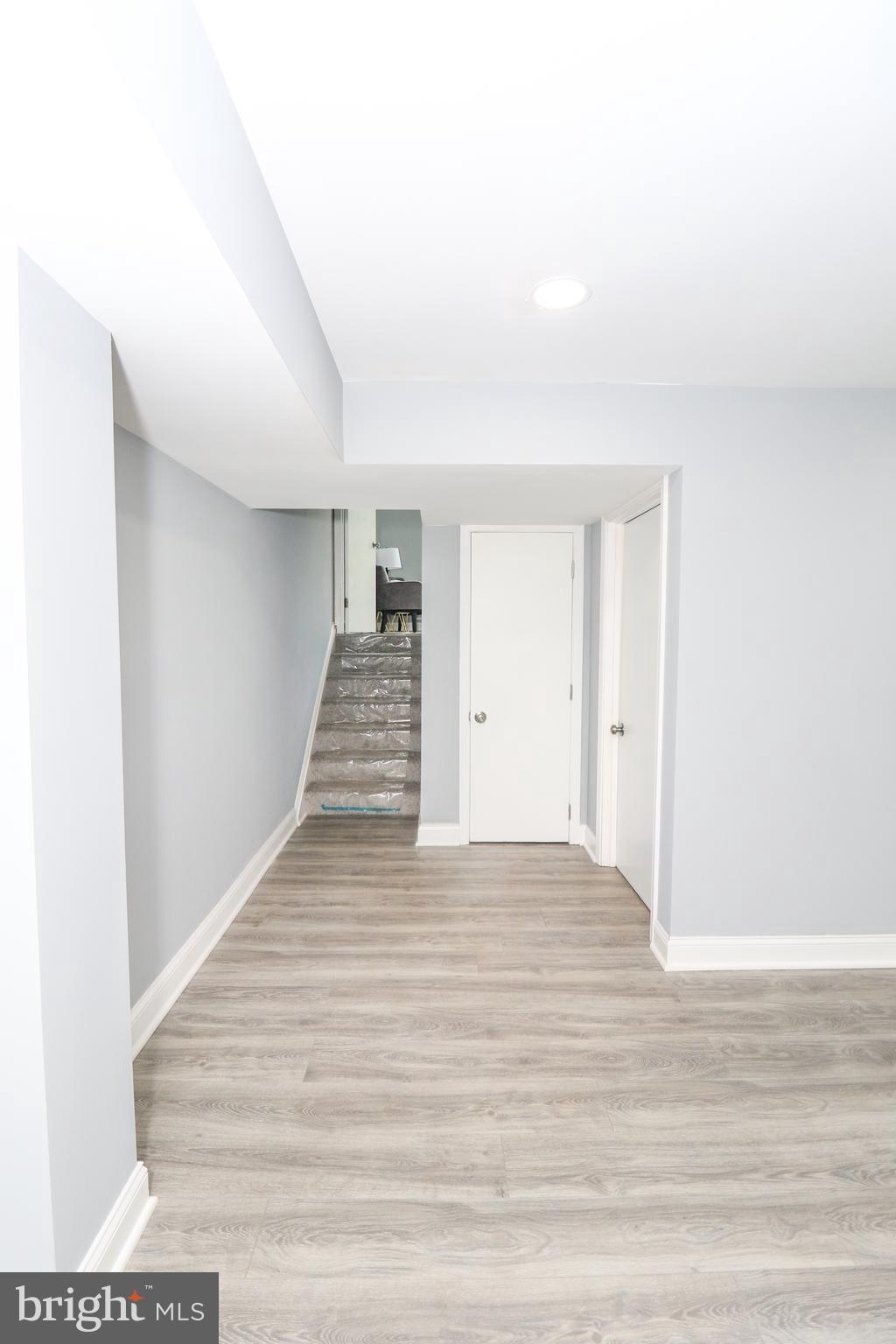 2309 Ravensdon Court Reston, VA 20191 - Photo 37 of 76 a view of a hallway with wooden floor