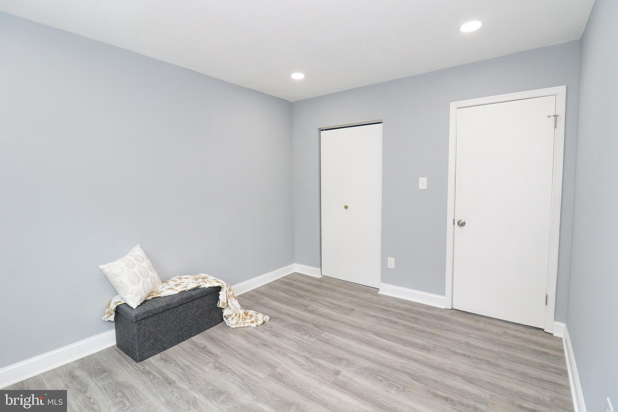 2309 Ravensdon Court Reston, VA 20191 - Photo 43 of 76 a living room with furniture and a wooden floor