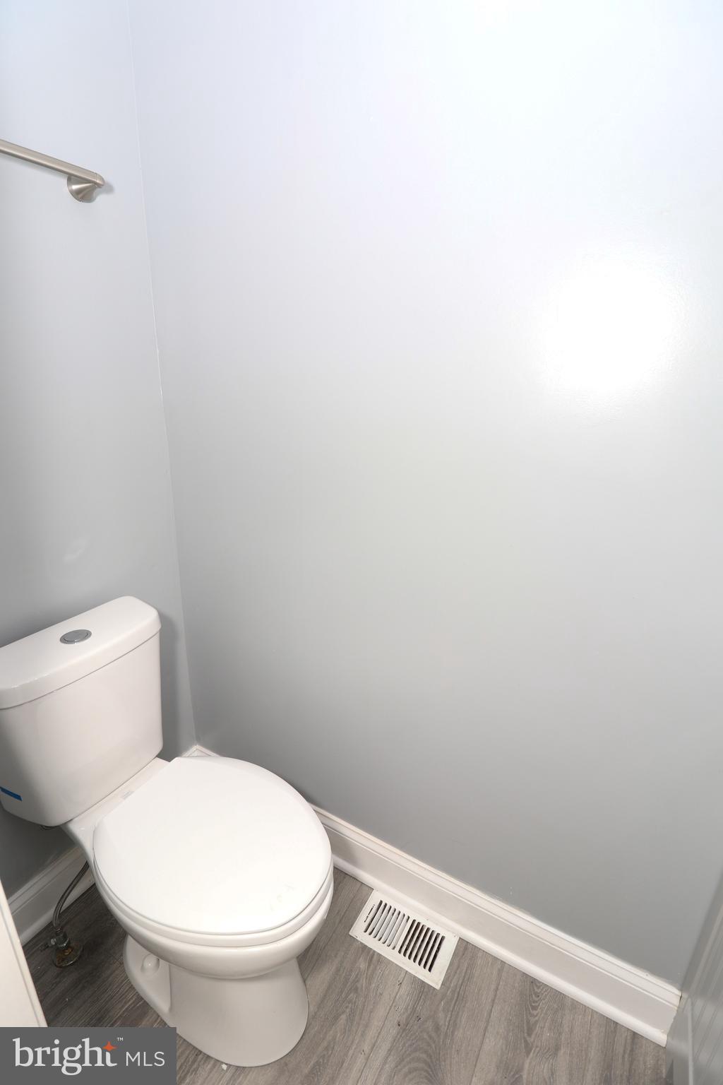 2309 Ravensdon Court Reston, VA 20191 - Photo 45 of 76 a white toilet sitting next to a white wall