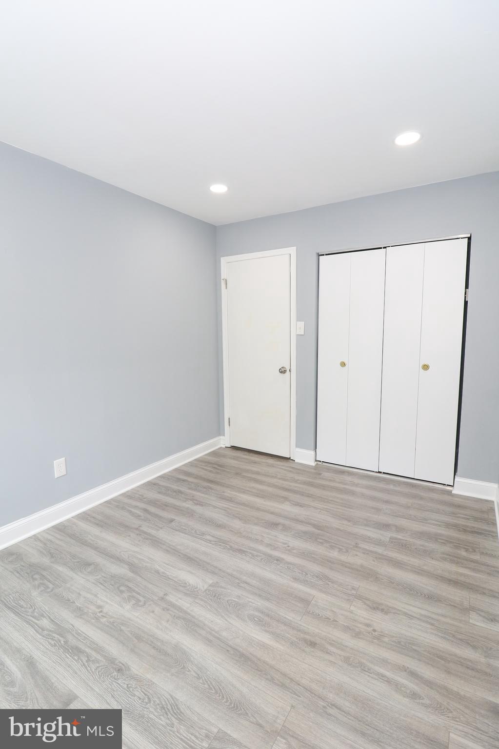 2309 Ravensdon Court Reston, VA 20191 - Photo 50 of 76 a view of an empty room with wooden floor