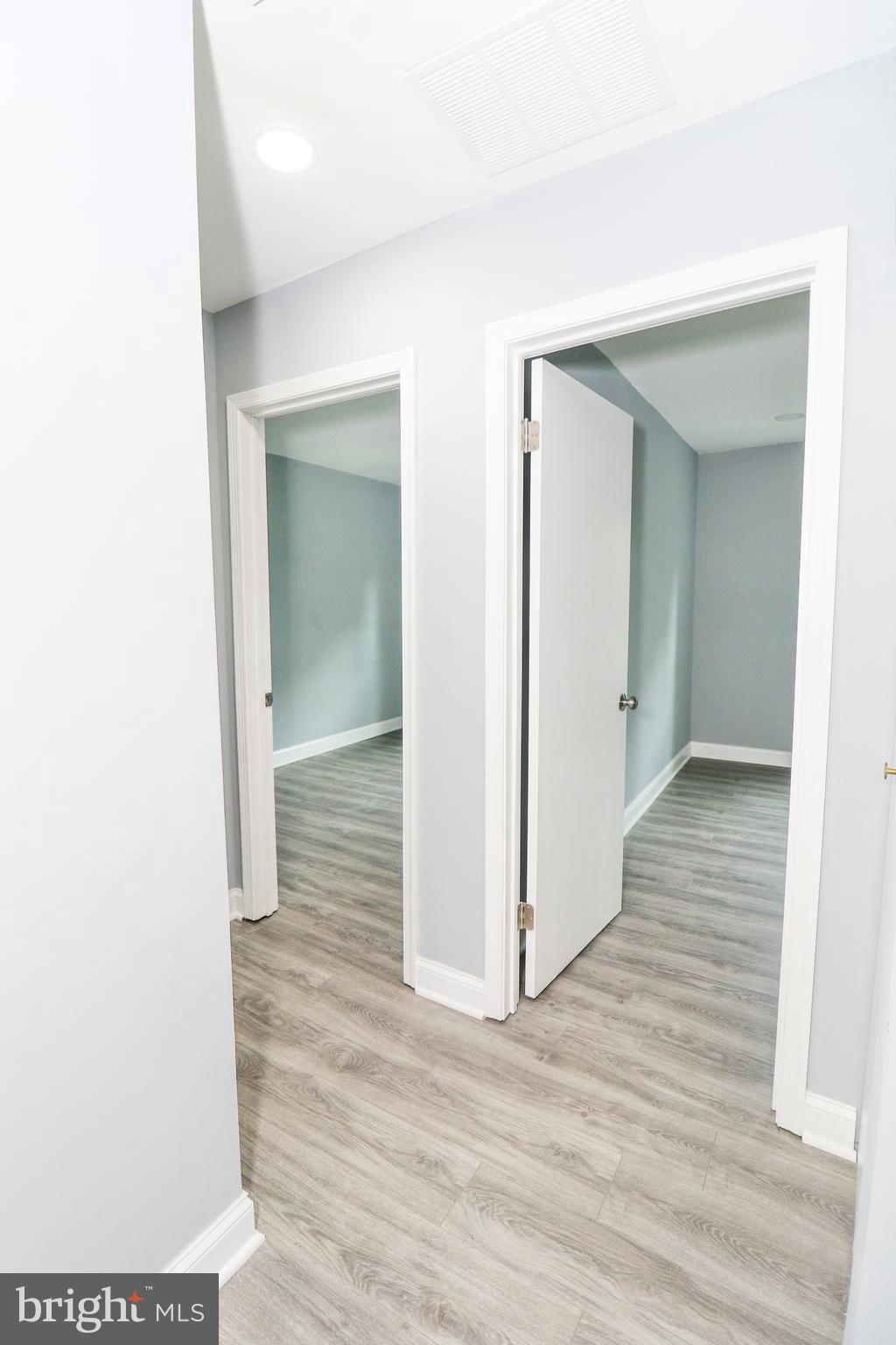 2309 Ravensdon Court Reston, VA 20191 - Photo 59 of 76 a view of a hallway with wooden floor
