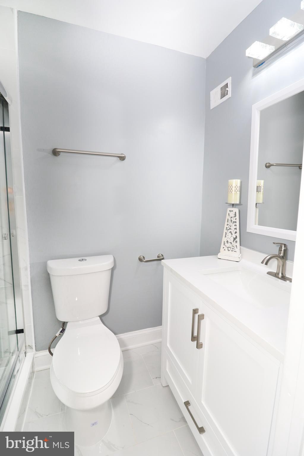 2309 Ravensdon Court Reston, VA 20191 - Photo 65 of 76 a bathroom with a toilet and a sink