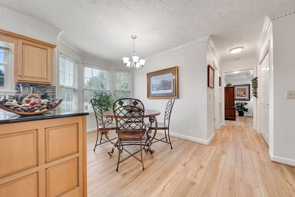 205 Spring Valley Road Hendersonville, TN 37075 - Photo 22 of 51 a view of a dining room with furniture chandelier and wooden floor