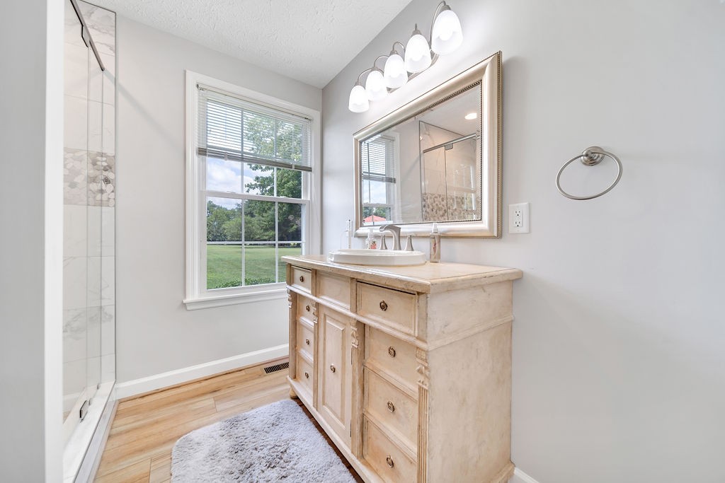 205 Spring Valley Road Hendersonville, TN 37075 - Photo 28 of 51 a bathroom with a double vanity sink window and mirror