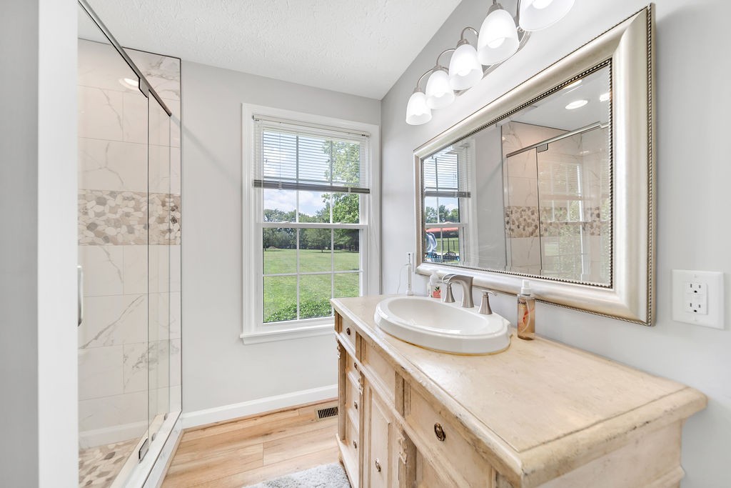 205 Spring Valley Road Hendersonville, TN 37075 - Photo 30 of 51 a bathroom with a granite countertop sink and a large mirror