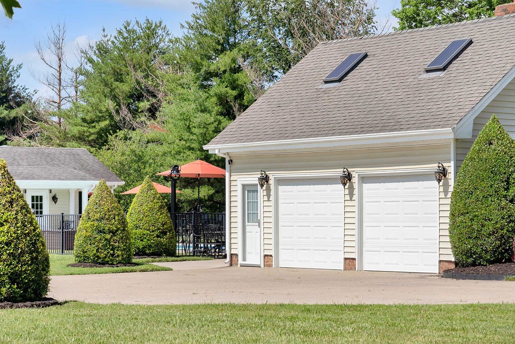 205 Spring Valley Road Hendersonville, TN 37075 - Photo 3 of 51 a front view of a house with a yard and garage