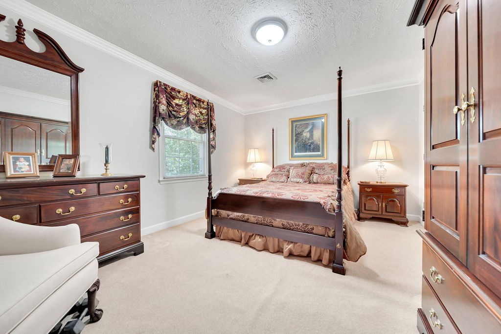 205 Spring Valley Road Hendersonville, TN 37075 - Photo 38 of 51 a bedroom with a bed and a dresser with mirror