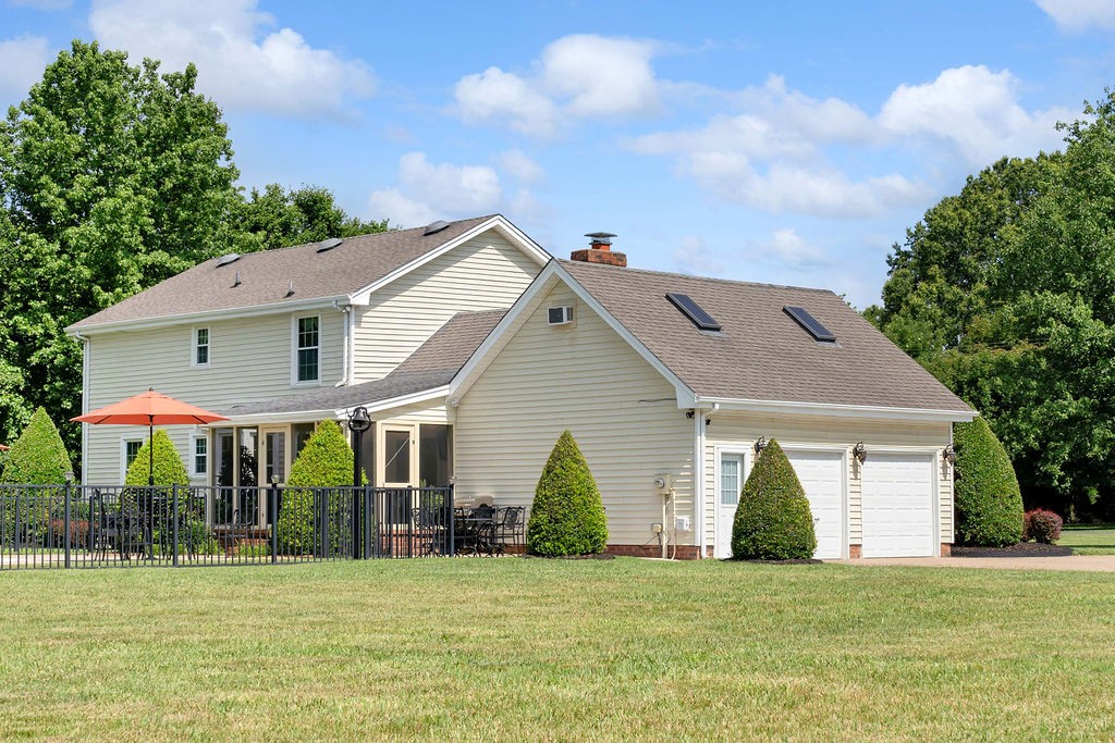 205 Spring Valley Road Hendersonville, TN 37075 - Photo 7 of 51 a view of a house with a yard and plants