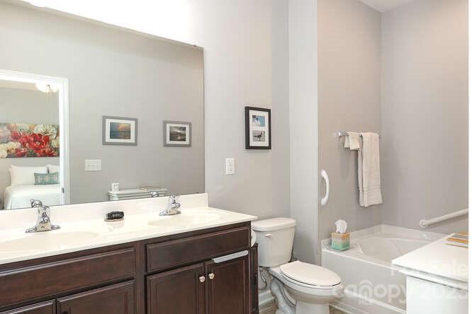 9728 Chase View Drive Matthews, NC 28105 - Photo 13 of 25 a bathroom with a sink a toilet and shower