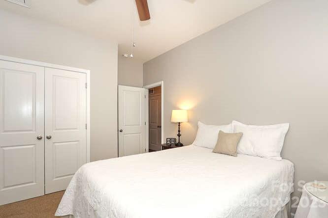 9728 Chase View Drive Matthews, NC 28105 - Photo 15 of 25 a bedroom with a bed and a closet