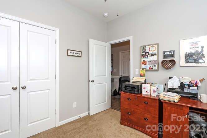 9728 Chase View Drive Matthews, NC 28105 - Photo 17 of 25 a room with furniture a cabinet and a window