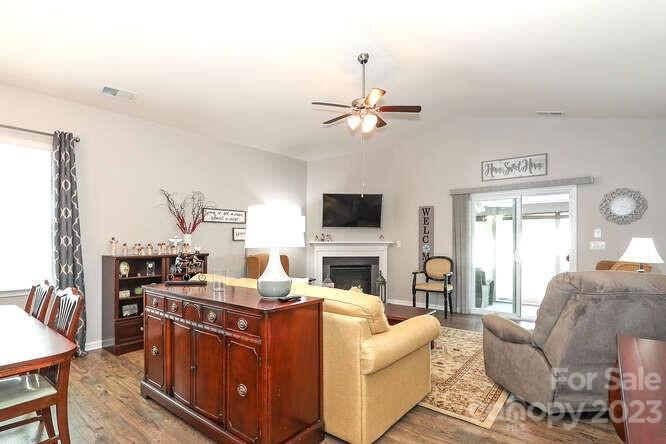 9728 Chase View Drive Matthews, NC 28105 - Photo 10 of 25 a living room with furniture and a flat screen tv
