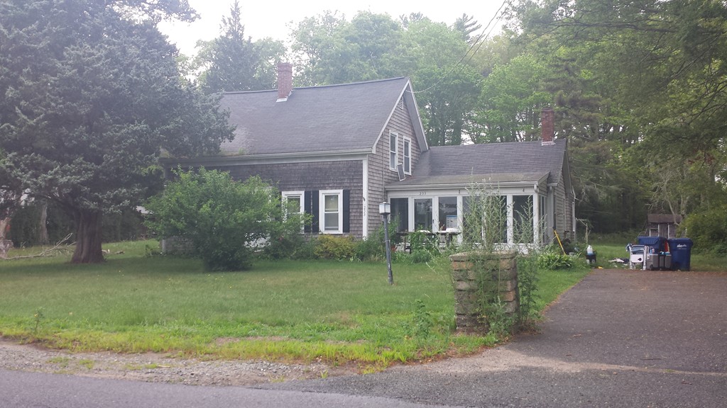233 Marion Road Rochester, MA 02770 - Photo 2 of 2 a front view of a house with a garden
