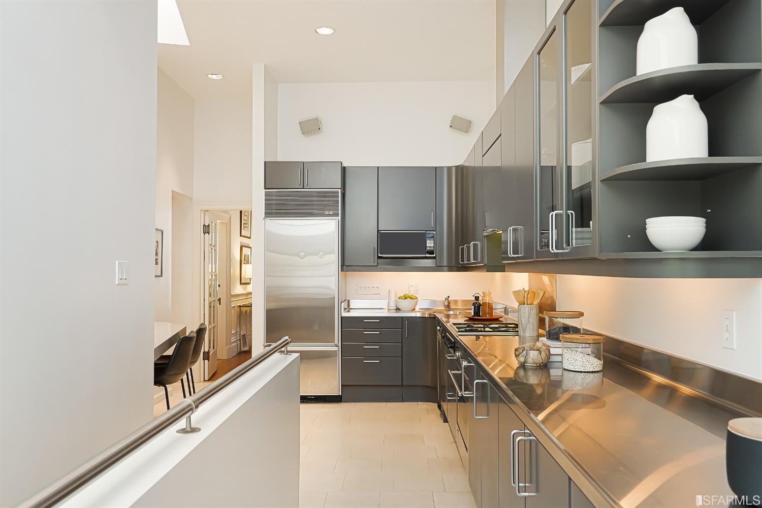 720 Waller Street San Francisco, CA 94117 - Photo 14 of 44 a kitchen with stainless steel appliances granite countertop a sink and a refrigerator