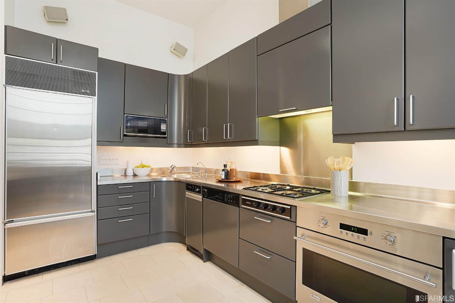 720 Waller Street San Francisco, CA 94117 - Photo 15 of 44 a kitchen with cabinets and appliances