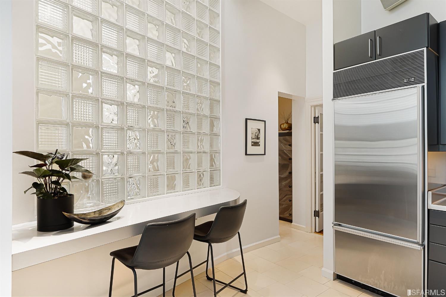 720 Waller Street San Francisco, CA 94117 - Photo 16 of 44 a table and chairs in a kitchen