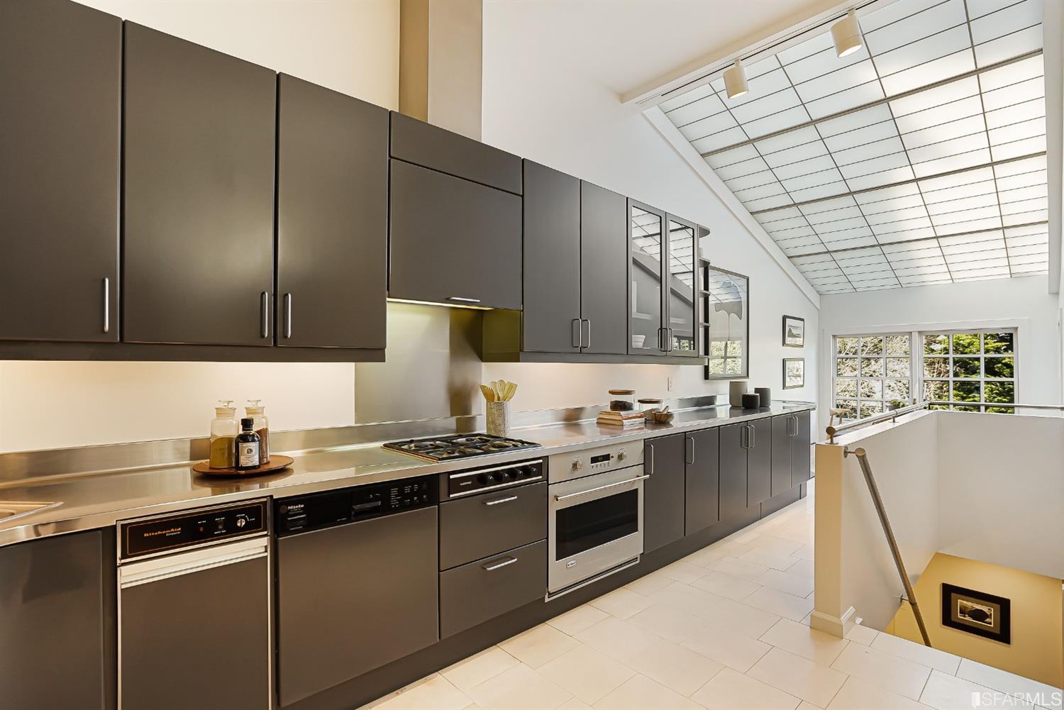 720 Waller Street San Francisco, CA 94117 - Photo 17 of 44 a kitchen with stainless steel appliances granite countertop a stove a sink dishwasher and a refrigerator