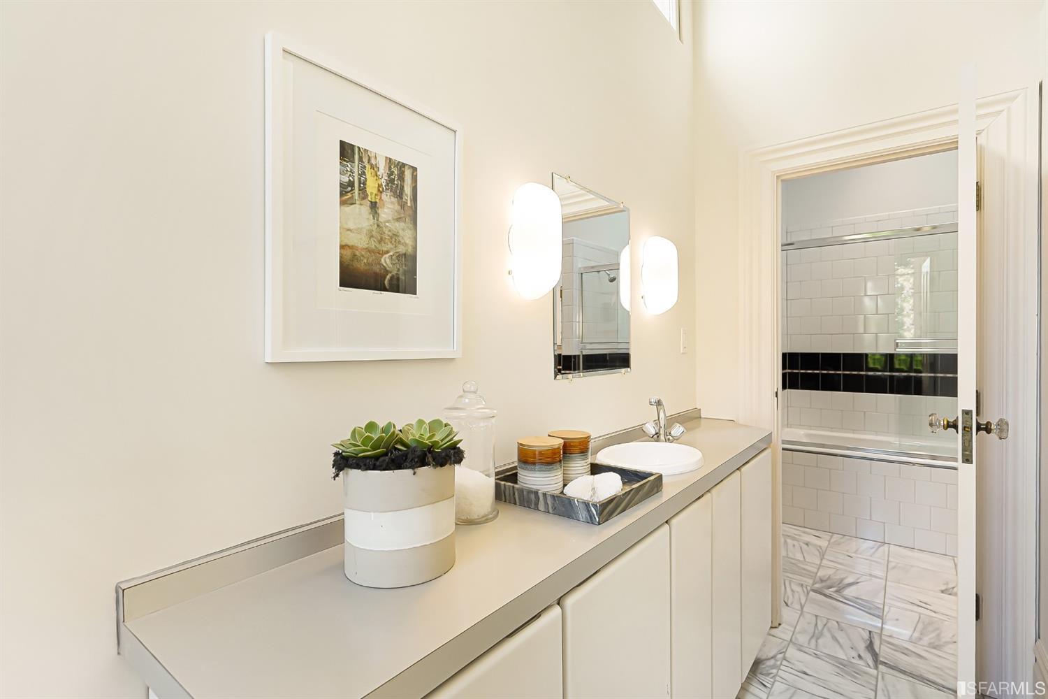 720 Waller Street San Francisco, CA 94117 - Photo 21 of 44 a kitchen with a sink and a mirror