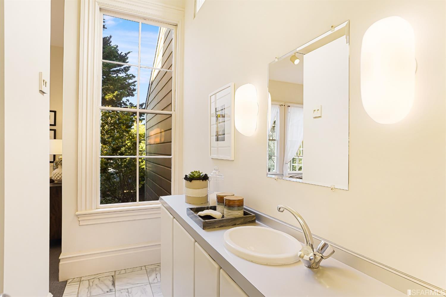 720 Waller Street San Francisco, CA 94117 - Photo 22 of 44 a bathroom with a sink and a mirror