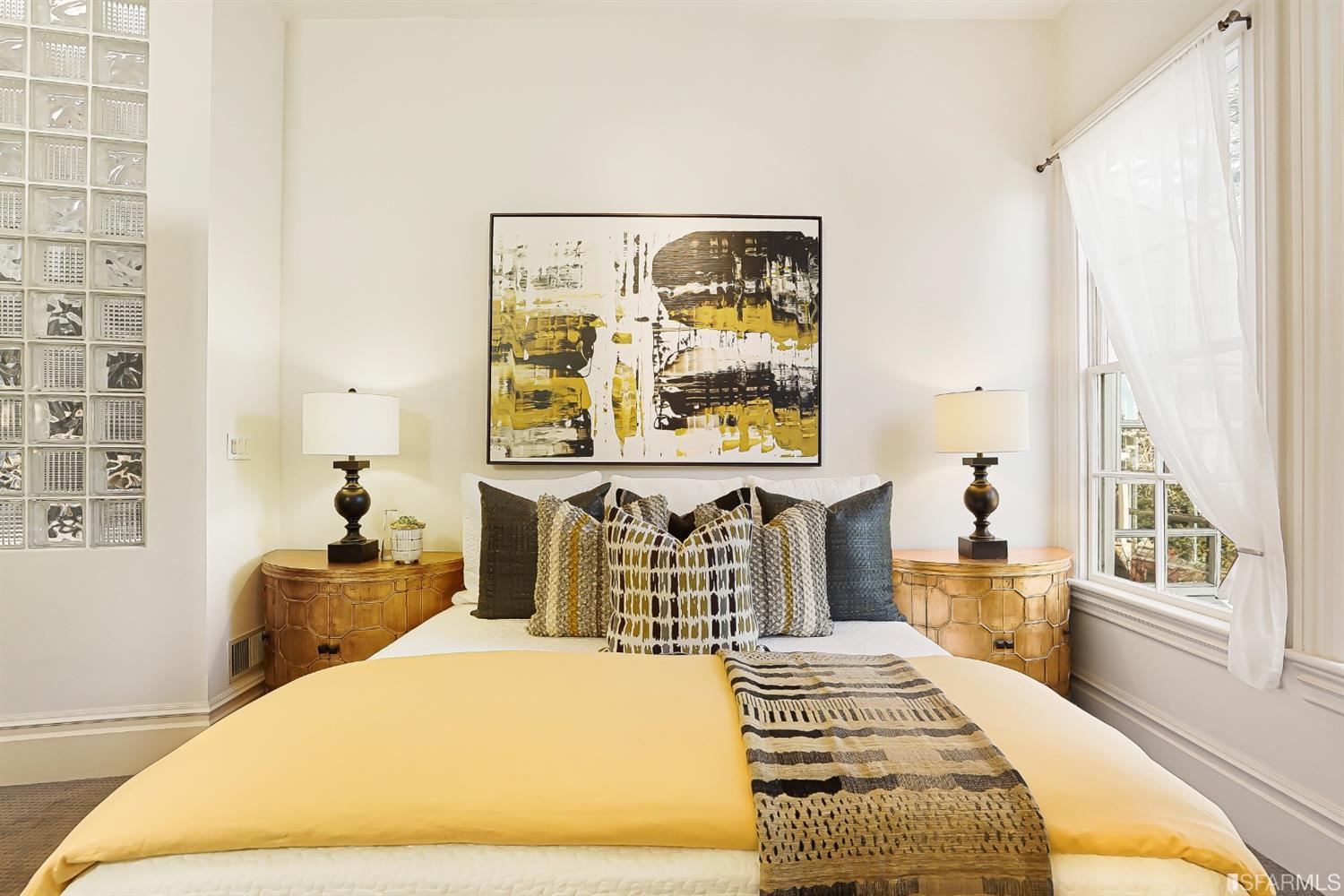 720 Waller Street San Francisco, CA 94117 - Photo 25 of 44 a bedroom with a bed and a painting on the wall