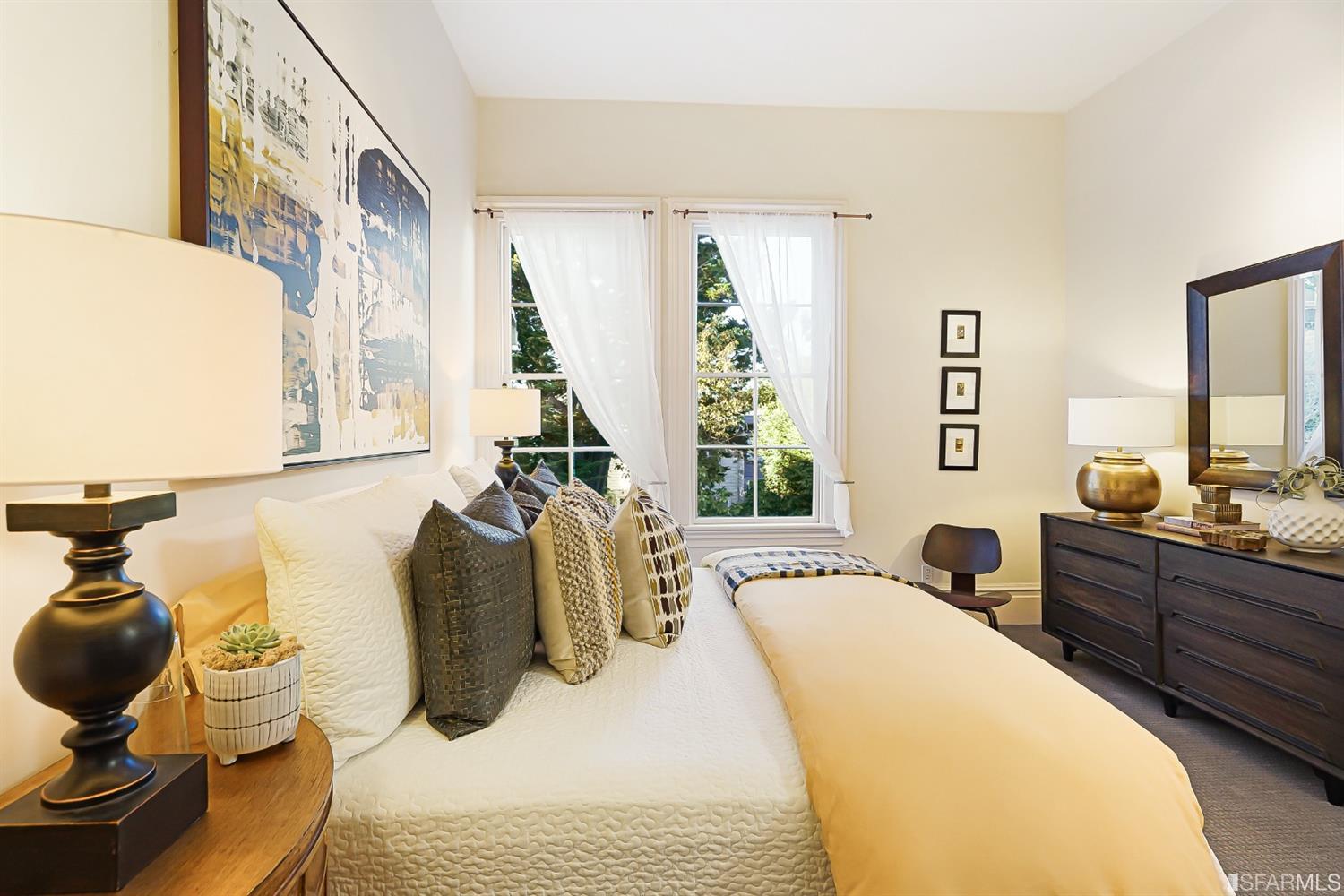 720 Waller Street San Francisco, CA 94117 - Photo 26 of 44 a bedroom with a bed and wooden floor