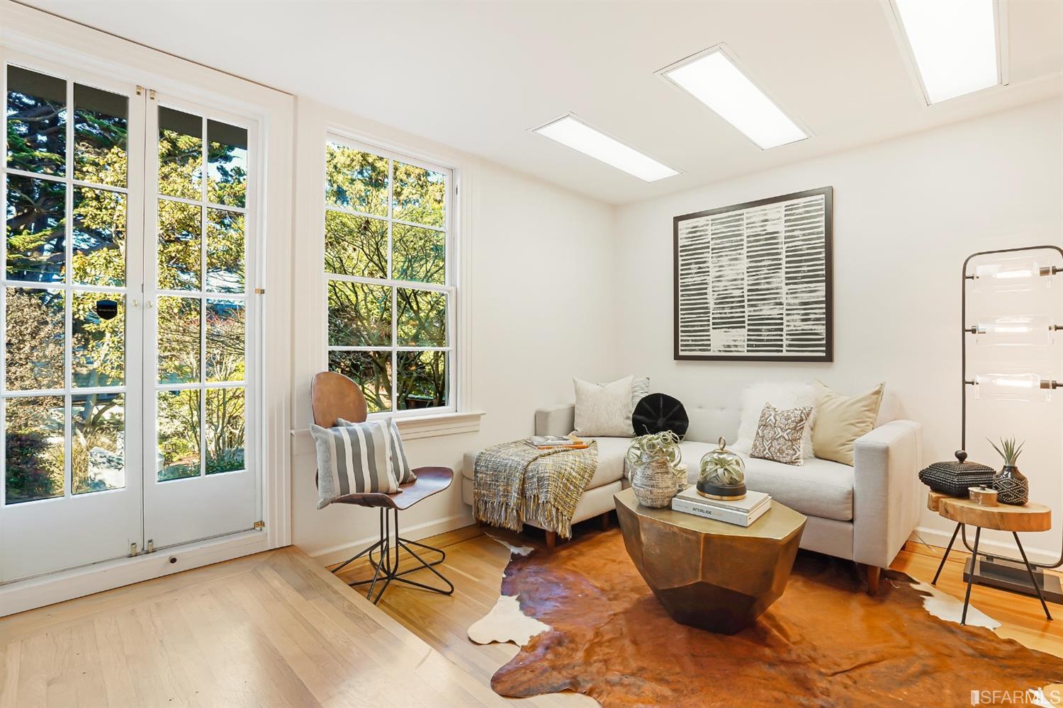 720 Waller Street San Francisco, CA 94117 - Photo 32 of 44 a living room with furniture and two large window
