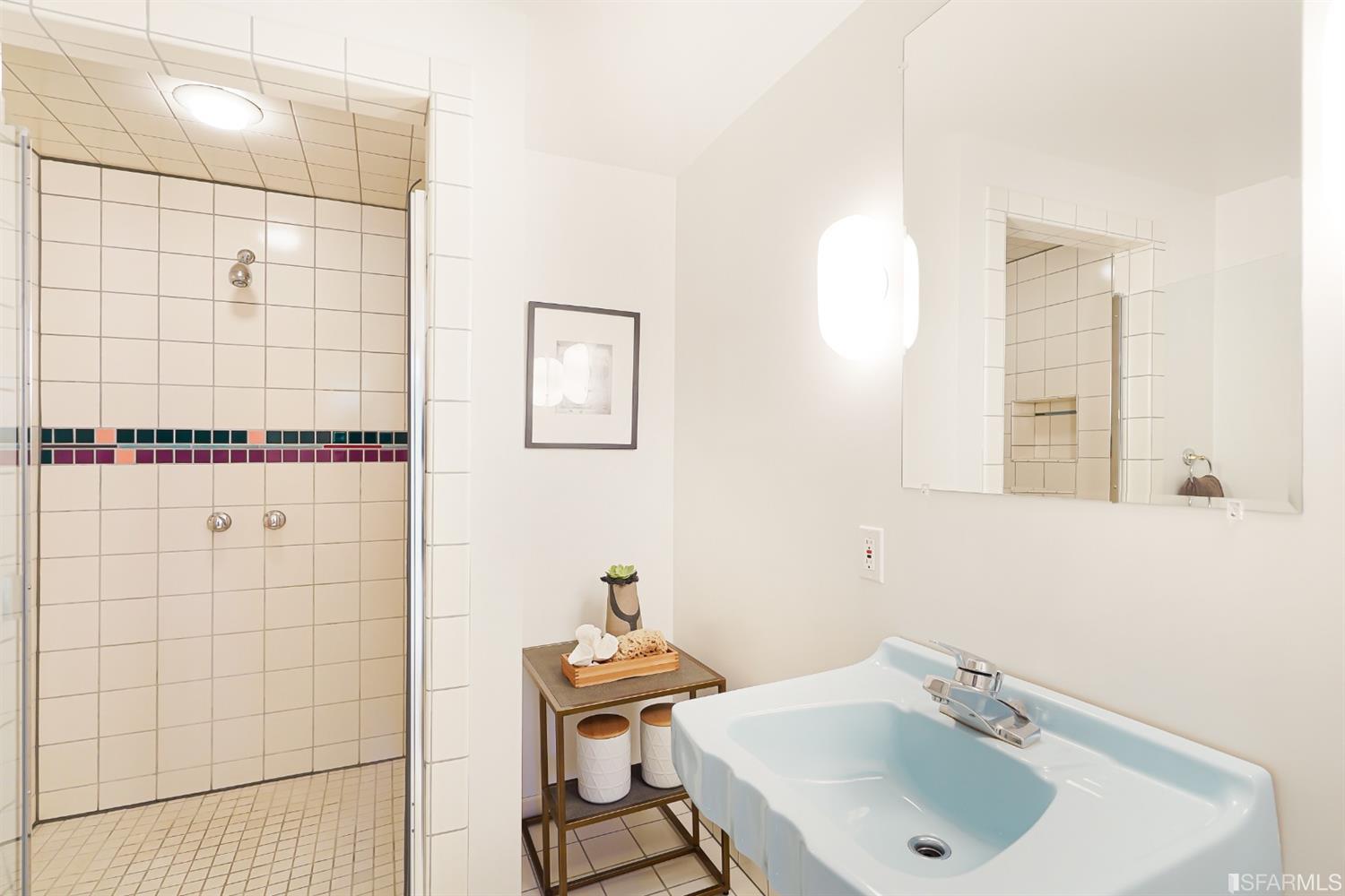 720 Waller Street San Francisco, CA 94117 - Photo 34 of 44 a bathroom with a sink window and shower