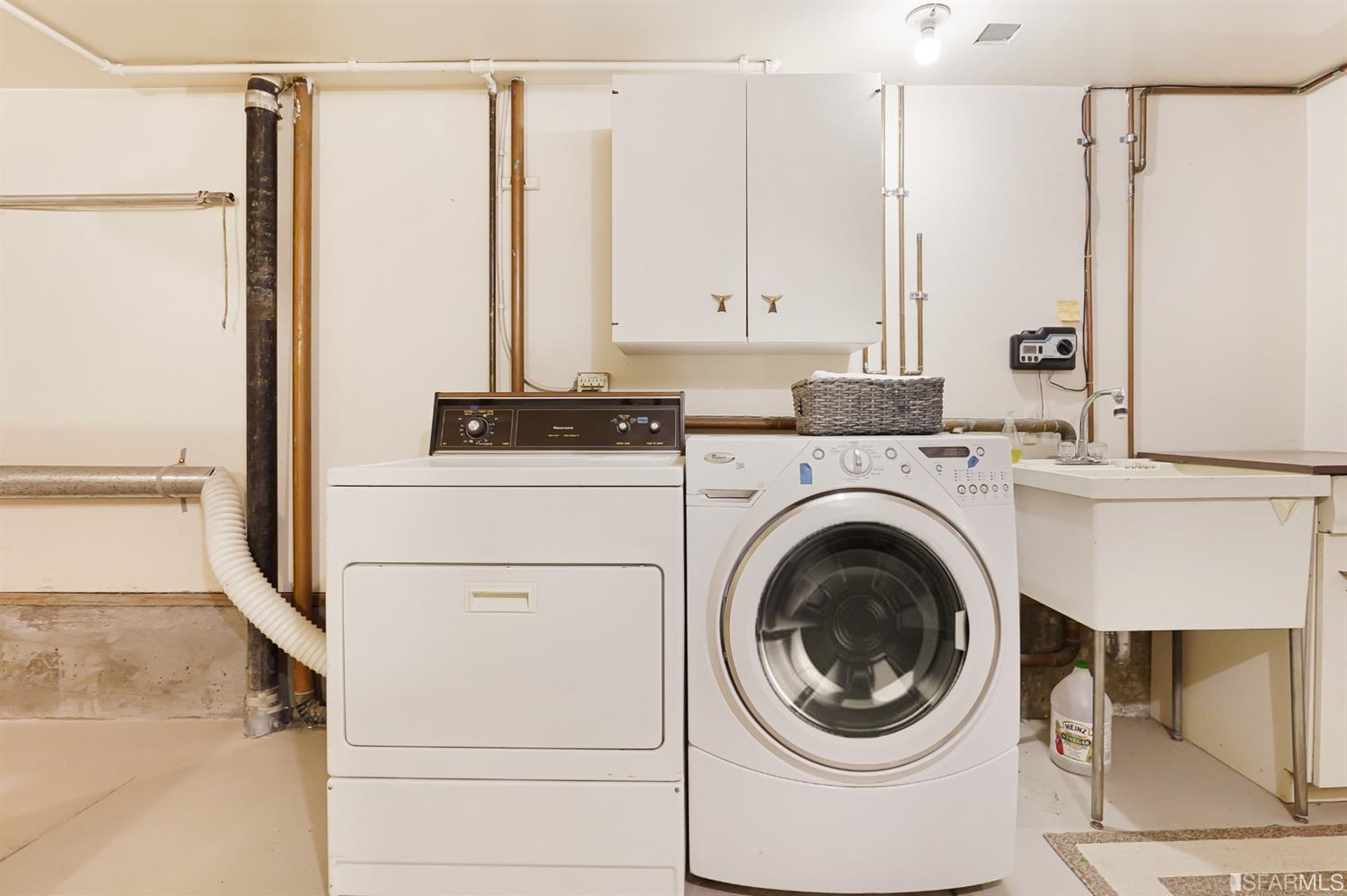 720 Waller Street San Francisco, CA 94117 - Photo 36 of 44 a utility room with dryer and washer