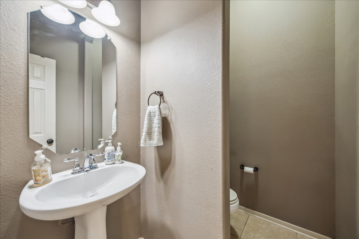 2902 Red Maple Drive Katy, TX 77494 - Photo 15 of 30 a bathroom with a sink and a mirror
