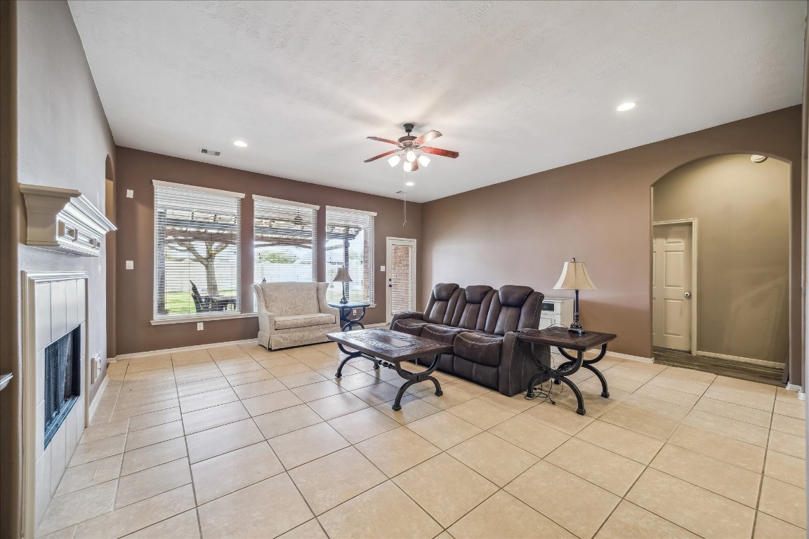 2902 Red Maple Drive Katy, TX 77494 - Photo 16 of 30 a living room with furniture and a fireplace